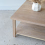 Square Modern Solid Wood Coffee Table With Lower Shelf Pictured in White Oak/ Natural