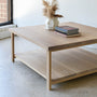 Square Modern Solid Wood Coffee Table With Lower Shelf Pictured in White Oak/ Natural