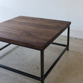 Square Stoic Coffee Table Pictured in Walnut Clear &amp; Blackened Metal