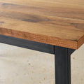 Close up of the blackened steel apron and legs on the Industrial Plank Extendable Dining Table in Reclaimed Oak Clear &amp; Blackened Metal Base