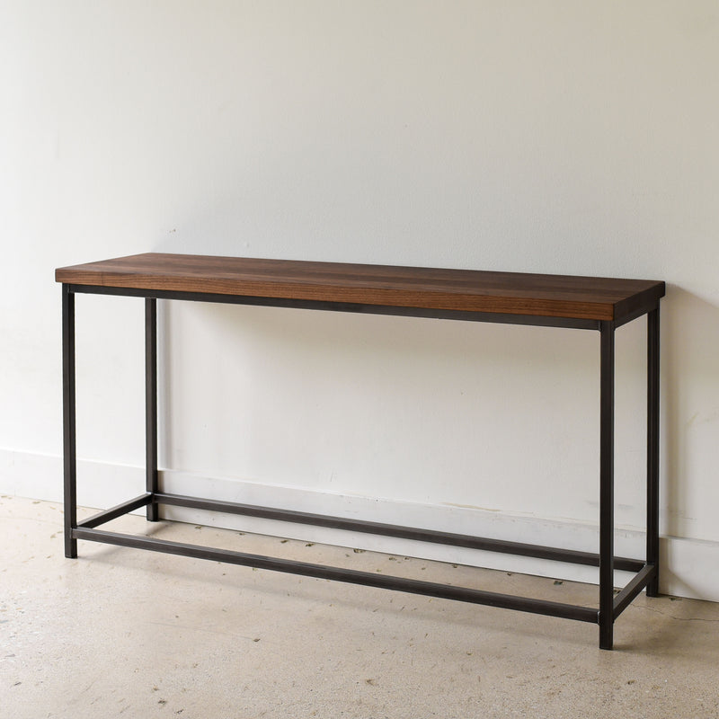 Stoic Wood Console Table Pictured In Walnut Clear &amp; Blackened Metal