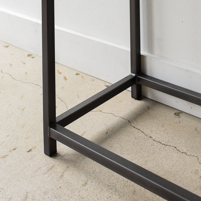Stoic Wood Console Table Pictured In Walnut Clear &amp; Blackened Metal - close up leg detail