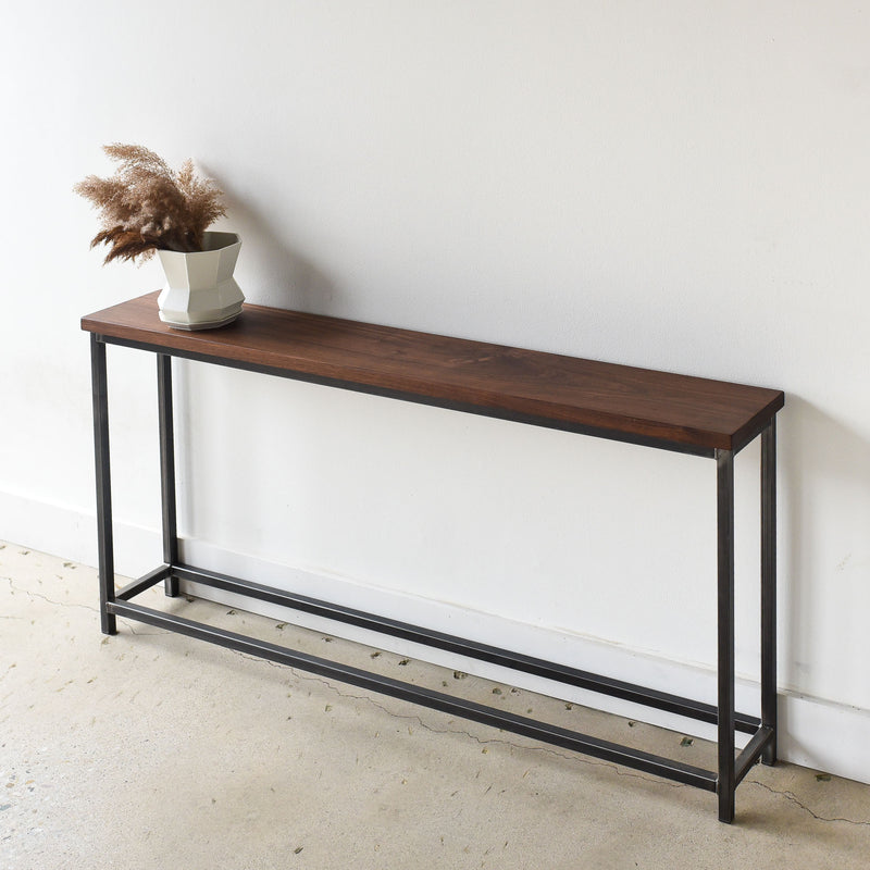 Stoic Wood Console Table Pictured In Walnut Clear &amp; Blackened Metal