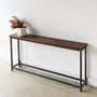 Stoic Wood Console Table Pictured In Walnut Clear &amp; Blackened Metal