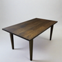 Slim Tapered Leg Dining Table Pictured in White Oak Black