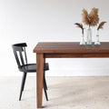 Extendable Tapered Leg Dining Table Pictured in Walnut Clear Featured with our <a href="/products/modern-windsor-chair"> Modern Windsor Chair</a> in Blackened Oak