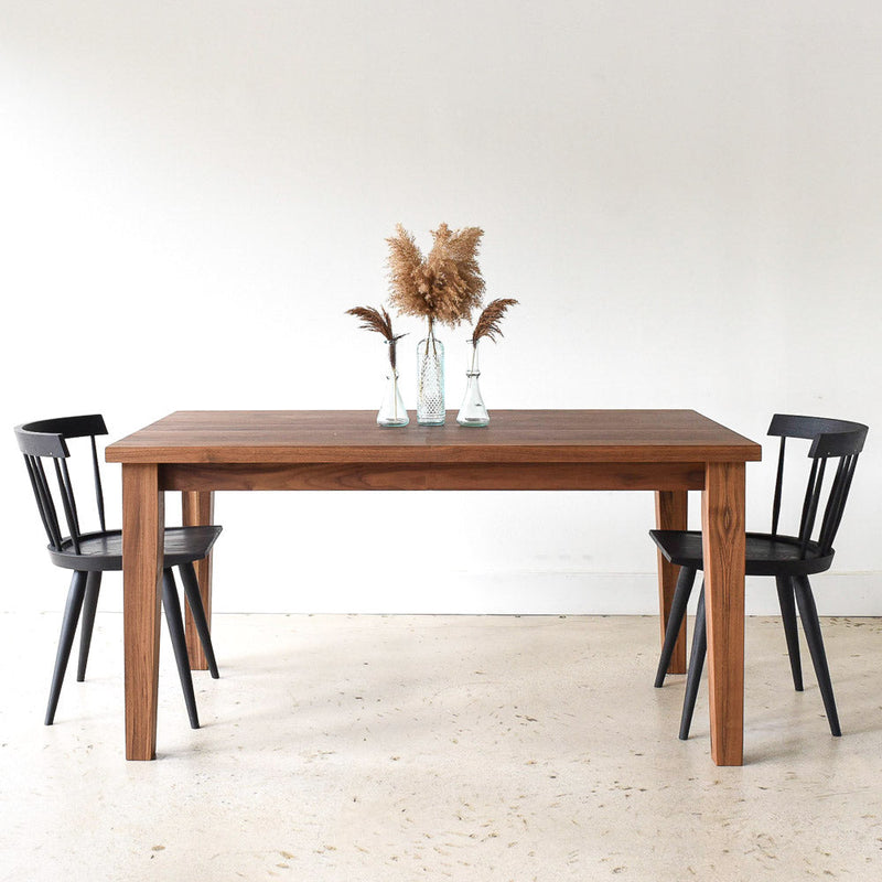 Extendable Tapered Leg Dining Table Featured pictured in Walnut Clear with our <a href="/products/modern-windsor-chair"> Modern Windsor Chair</a> in Blackened Oak