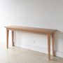 Tapered Leg Console Table With Hidden Drawer Pictured In White Oak Natural