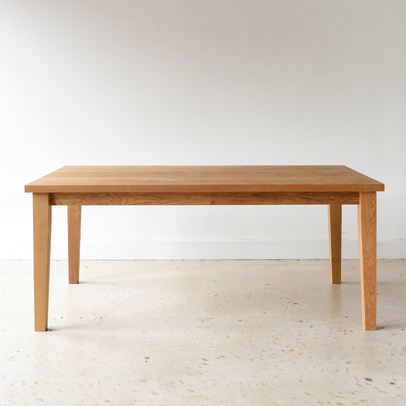 Plank Tapered Leg Dining Table pictured in White Oak Clear 