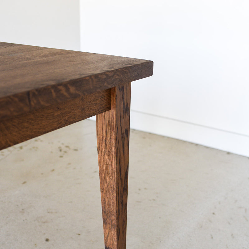 Slim Tapered Leg Detail Pictured in Reclaimed Oak Walnut Finish