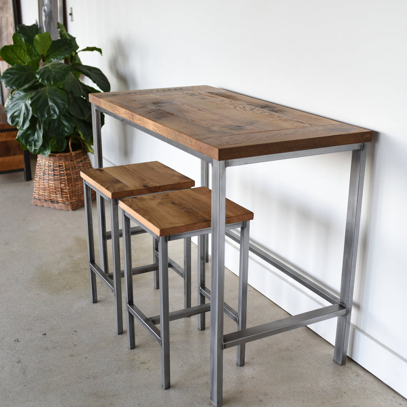 Counter Height Wood Kitchen Table Featured with our &lt;a href=&quot;/products/rustic-reclaimed-oak-backless-bar-stools&quot;&gt; Industrial Modern Backless Stools&lt;/a&gt; in Reclaimed Oak / Clear