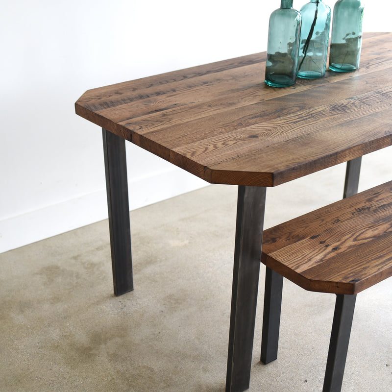 Clipped Corners Post Leg Dining Table featured with our &lt;a href=&quot;https://wwmake.com/products/modern-clipped-corner-bench-post-steel-legs&quot;&gt; Clipped Corner Bench &lt;/a&gt; in Reclaimed Oak / Walnut &amp; Blackened Metal Legs