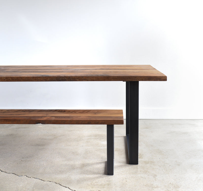 Industrial Modern Dining Table in Reclaimed Oak/ Textured with Blackened Metal U-shaped Legs. Featured with our &lt;a href=&quot;https://wwmake.com/products/industrial-modern-reclaimed-wood-bench-u-shaped-metal-legs-anhr7&quot;&gt; Industrial Modern Bench &lt;/a&gt; 
