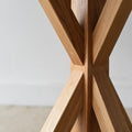 Round Pedestal Dining Table in White Oak / Clear - Close up detail of pedestal base