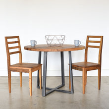 Round Criss Cross Base Dining Table paired with our &lt;a href=&quot;https://wwmake.com/products/reclaimed-wood-dining-chairs-barnwood-dining-chairs&quot;&gt; Farmhouse Wood Dining Chairs&lt;/a&gt; in Reclaimed Oak / Clear  &amp; Blackened Metal