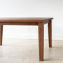Pictured in Walnut / Clear Finish, Plank Tapered Leg Dining Table - Close up of Leg Detail