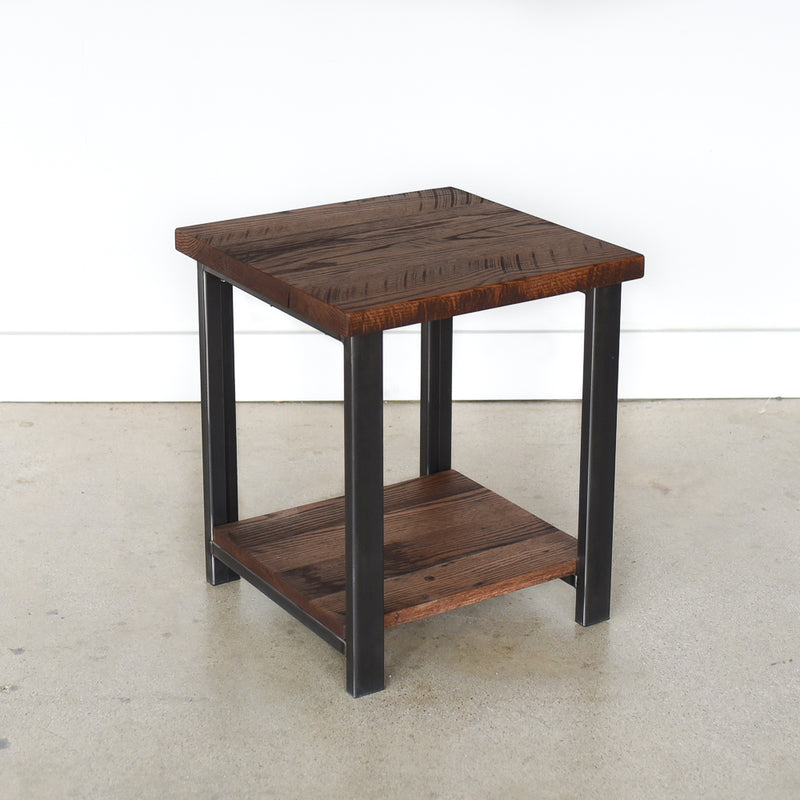 Metal and wood side table pictured in Reclaimed Oak / Walnut &amp; Blackened Metal